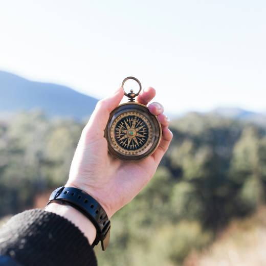 A person holding a compass